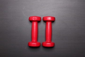 Two Red dumbbells, fitness concept .Number Two