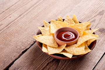 nachos with sauce on the table