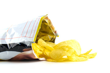 heap of potato crisps on white