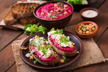Vegan sandwiches with beetroot hummus, cucumber and blue cheese