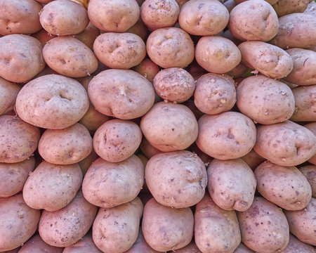 raw organic potatoes closeup, natural background