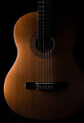 Obraz premium acoustic guitar on black background