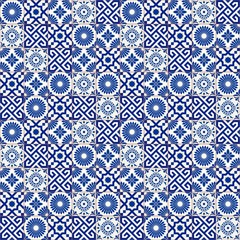 Stylish seamless pattern patchwork mix of five Moroccan tiles in trendy shades of blue.