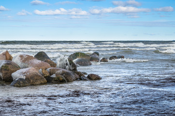 Sea waves breaking on the rocks, seascape