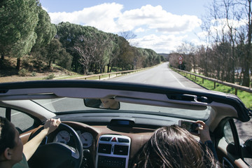 Women in a cabriolet car