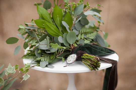 Green wedding bouquet of eucalyptus, ivy, fern, aspidistra, rusk
