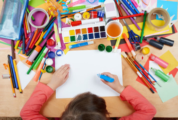 Obraz premium Child drawing top view. Artwork workplace with creative accessories. Flat lay art tools for painting.