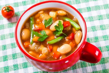 Minestrone vegetable soup with parmesan cheese, beans, cauliflow