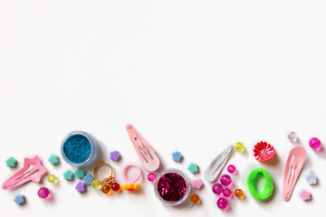 Little girl accessories lifestyle set on white background. Many little girl accessories scattered...