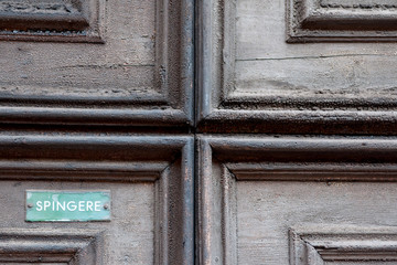 Old doorknobs, doorknockers and handles on ancient doors