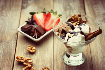 Ice cream sundae, chocolate and sliced strawberry