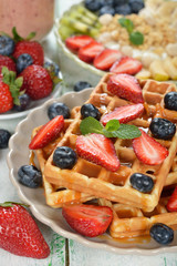 Waffles with berries and caramel sauce