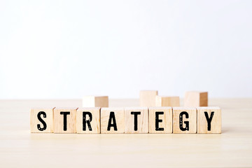 Strategy word on wooden cubes, business concept