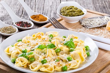 tortellini with green peas, Pine nuts, parmesan cheese and grater