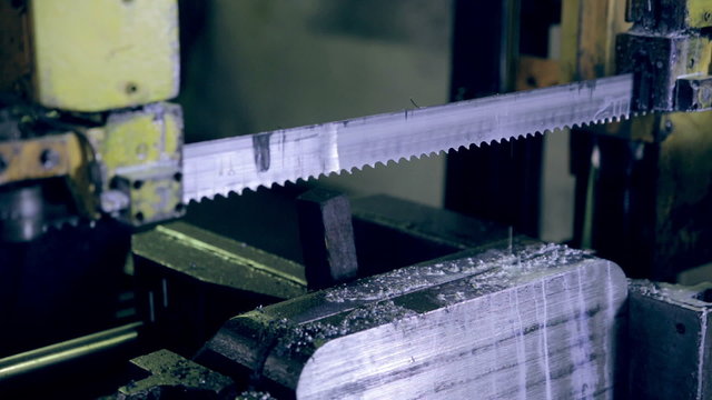 Sawing metal on industrial circular saw. HD.