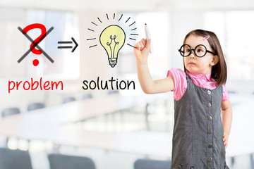 Cute little girl wearing business dress and eliminate problem and find solution. Office background.