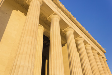 Naklejka premium Morning sunshine covering the colossal Doric order columns of the eastern exterior of the Lincoln Memorial, National Mall and Memorial Parks, Washington DC