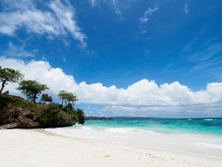 White sand tropical beach and blue sky