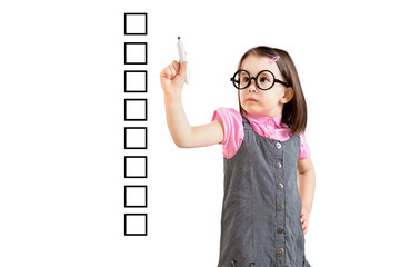 Cute little girl wearing business dress and writing on some blank checklist boxes. White background.