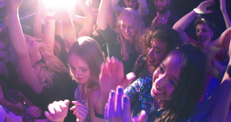 Women and Girls dancing and cheering in club during party - Powered by Adobe
