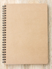 Small notepad on wood background
