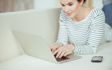 Attractive female freelancer is working at home