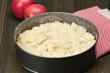 Raw Traditional Homemade German Apple Pie. Wooden Table.