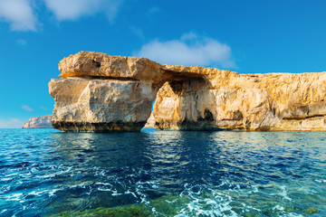 Azure Window, famous stone arch of Gozo island in the sun in the - obrazy, fototapety, plakaty