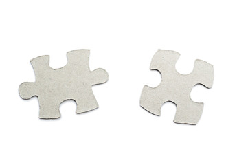 Fototapeta premium cardboard puzzles pieces on a white background