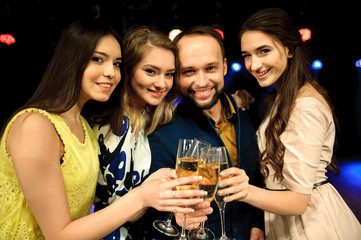 Fototapeta premium cheerful young company celebrates birthday in a nightclub