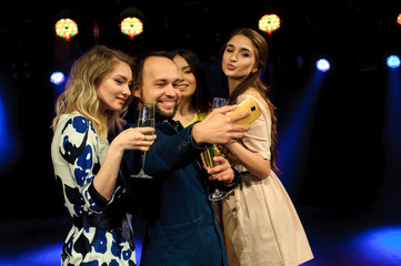 cheerful young company celebrates birthday in a nightclub