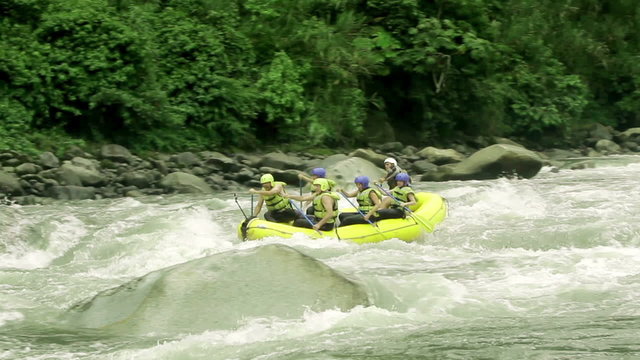 Experience the thrill of a level five rafting adventure as a group of tourists capture unforgettable moments through on board and external camera shots.