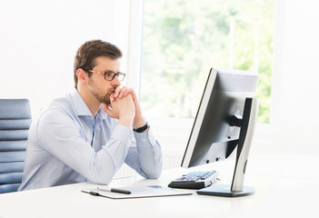 Young businessman working in a modern office