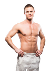 Fototapeta premium Strong, fit and sporty bodybuilder man isolated on white.