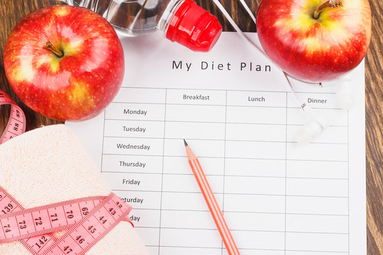 Diet plan, apples and towel, wooden background