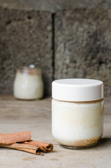 Cinnamon yogurt, rustic background.