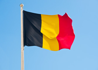Flag of Belgium  against blue sky