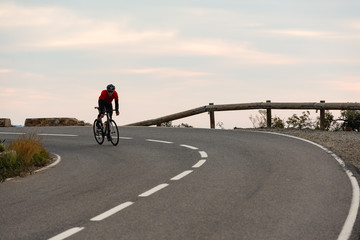 Fototapeta na wymiar Early Morning Road Cycling along the Coastal Highway