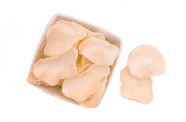 Krupuk of square bowl on a white background seen from above