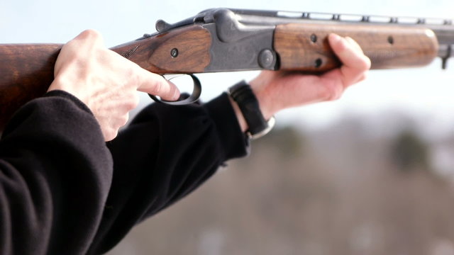 Man shooting with gun Slow Motion Close Up