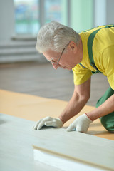 Senior man  repairing in the room