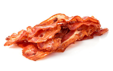 Cooked bacon rashers close-up isolated on a white background.