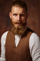 Close portrait of man with beard and mustache. 