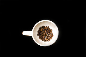 Coffee cup with grain isolated on black background