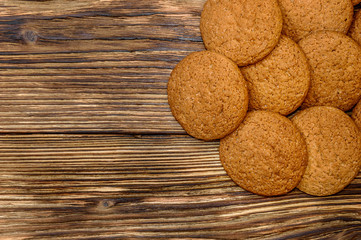 Oatmeal cookies on wooden background. Top view