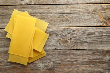 Lasagne sheets pasta on a grey wooden table