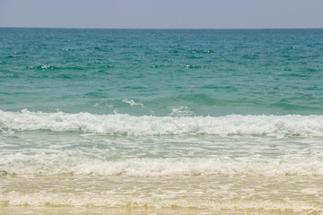 Fototapeta na wymiar Sea wave on the sand beach