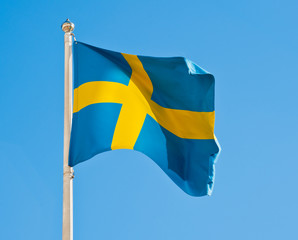 Flag of Sweden against blue sky
