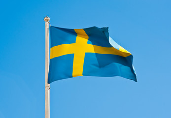 Flag of Sweden against blue sky
