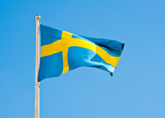 Flag of Sweden against blue sky
